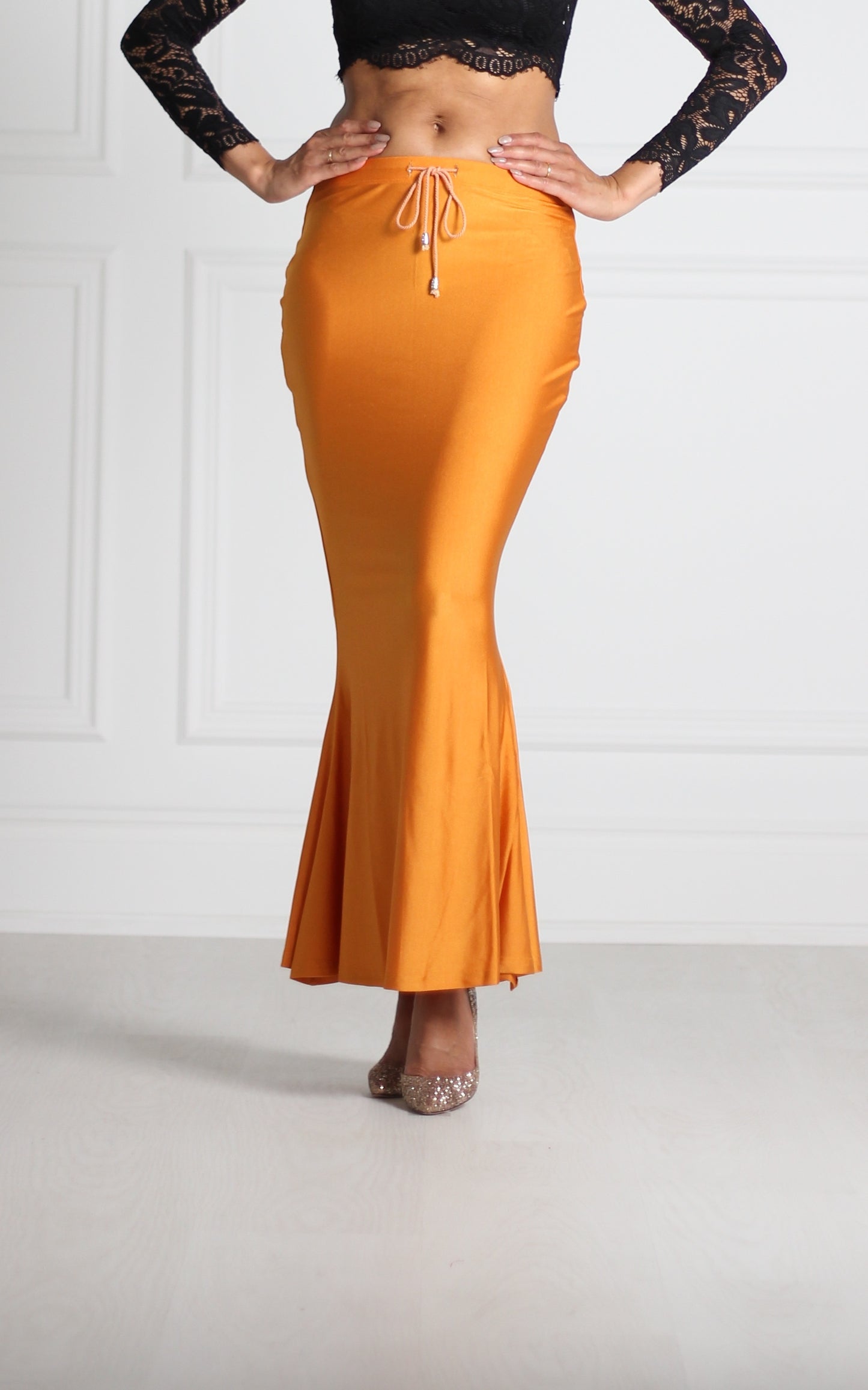 Butterscotch Saree Silhouette™ petticoat with a high waist and mermaid-style flare, designed to smooth the body and support any saree drape. Ideal underskirt for pleating, tucking and styling.