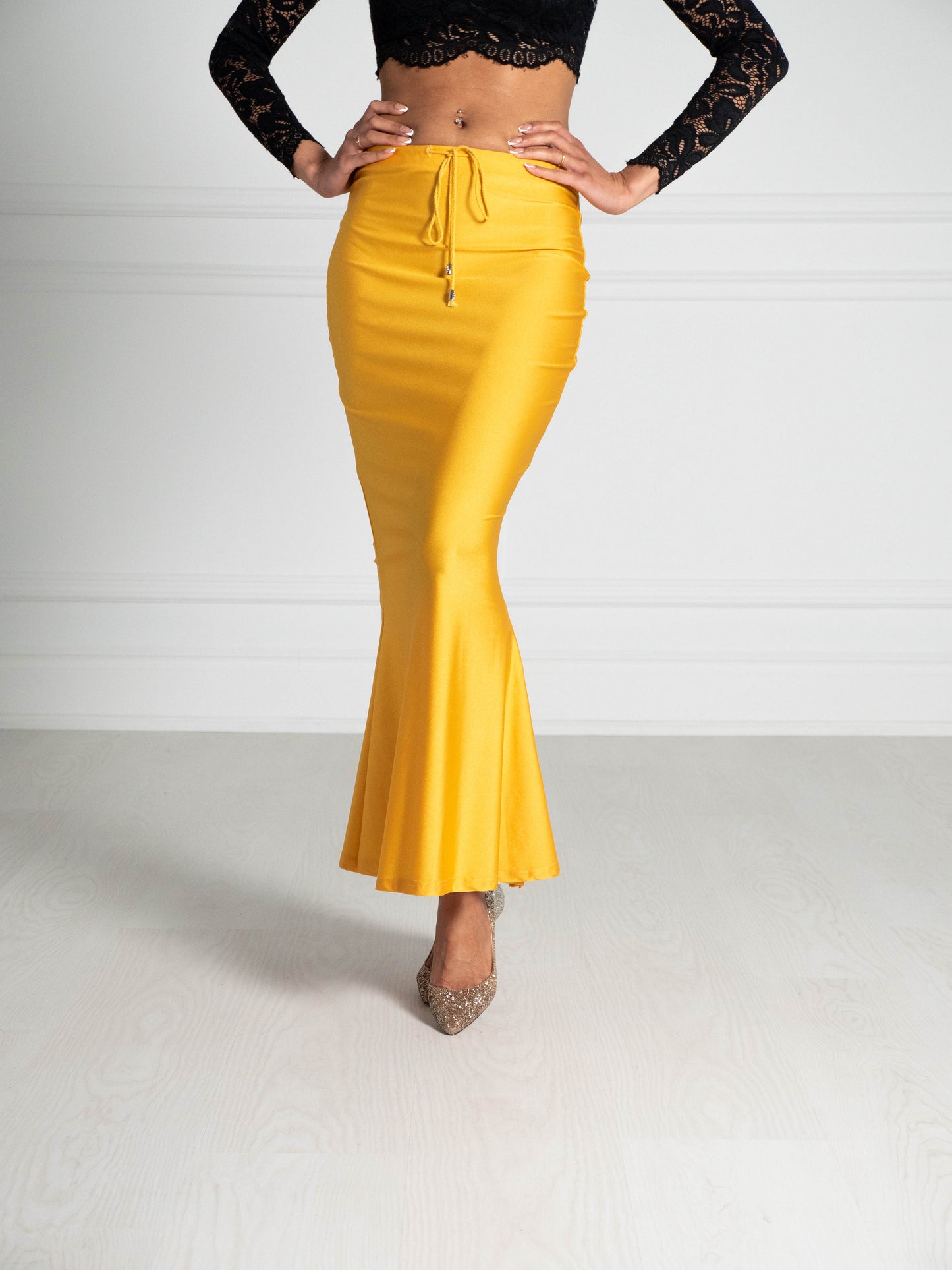 Liquid Gold Saree Silhouette™ petticoat with a high waist and mermaid-style flare, designed to smooth the body and support any saree drape. Ideal underskirt for pleating, tucking and styling.