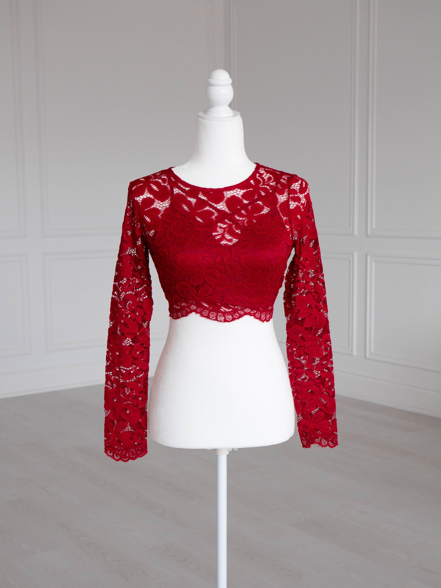 Vino Lace Crop Top with floral pattern, scalloped edges and sheer sleeves, designed to pair with sarees or lehengas. Readymade, fully lined body with reversible neckline.