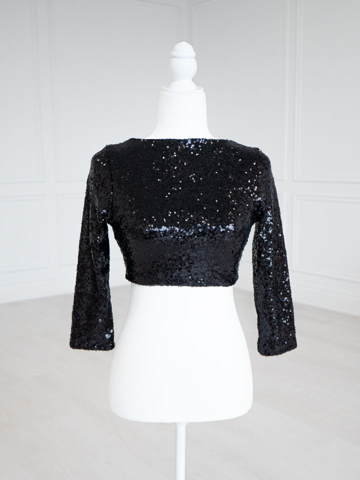 Black Sequin Blouse with a scoop neckline, sleeveless design and stretch lining for a close fit. Fully finished and ready to wear with sarees, lehengas or skirts.