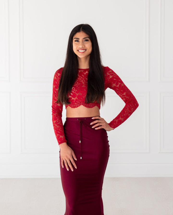 Vino Lace Crop Top with floral pattern, scalloped edges and sheer sleeves, designed to pair with sarees or lehengas. Readymade, fully lined body with reversible neckline.