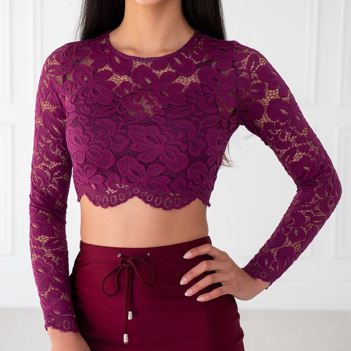 Plum Lace Crop Top with floral pattern, scalloped edges and sheer sleeves, designed to pair with sarees or lehengas. Readymade, fully lined body with reversible neckline.